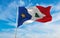 flag of French ancestry New England Acadians at cloudy sky background, panoramic view. flag representing extinct country,ethnic