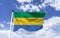 Flag of Gabon. Trembling under a blue sky