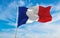 flag of Gallo-Romance peoples French people at cloudy sky background, panoramic view. flag representing extinct country,ethnic