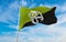 flag of Geo-Anarchist at cloudy sky background on sunset, panoramic view. Anarchism symbol.. copy space for wide banner. 3d