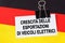 On the flag of Germany lies a business card with the inscription - growth in exports of electric vehicles