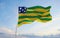 flag of Goias , Brazil at cloudy sky background on sunset, panoramic view. Brazilian travel and patriot concept. copy space for