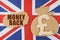 On the flag of Great Britain, a bag with a money symbol and a cardboard with the inscription - MONEY BACK