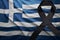 Flag of greece with black mourning ribbon