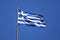 Flag of Greece on flagpole in sun