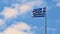 Flag of Greece Flying in Wind and Blue Sky. Summer background for travel and holidays. Greece Crete.