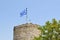 Flag of Greece on the old tower.