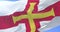 Flag of Guernsey waving at wind in slow, loop