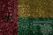 Flag of guinea bissau on a old metal rusty cracked wall with text coronavirus, covid, and virus picture