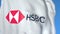 Flag with HSBC Holdings plc logo, close-up. Editorial 3D rendering