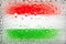 Flag of Hungary. Hungary flag on the background of water drops. Flag with raindrops. Splashes on glass