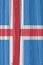 The flag of Iceland on a dry wooden surface, cracked with age. Light pale faded paint. Patriotic background or wallpaper.
