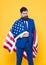 The flag inspiring feelings of pride and security. Confident businessman wearing american flag with pride. Bearded man