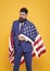 The flag inspiring feelings of pride and security. Confident businessman wearing american flag with pride. Bearded man