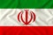 Flag of Iran on a gentle silk with folds in the wind