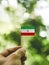 The Flag of the Iran which is held in hand.