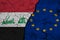 Flag of iraq and EU on Textured Cracked Earth. The concept of cooperation between the two countries