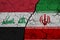 Flag of iraq and Iran on Textured Cracked Earth. The concept of cooperation between the two countries