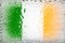 Flag of Ireland. Ireland flag on the background of water drops. Flag with raindrops. Splashes on glass
