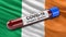 Flag of Ireland waving in the wind with a positive Covid-19 blood test tube. 3D illustration concept.