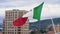 Flag of Italy against the background of the ancient cathedral. Stock. Italian flag in the wind develops