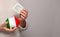 Flag of Italy on money bank in Italian woman hands. Dotations, pension fund, poverty, wealth, retirement concept