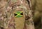 Flag of Jamaica on soldier arm. Flag of Jamaica on military uniforms (collage).