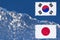 The flag of Japan and South Korea are painted at opposite end of piece of ice in the form of an arctic iceberg against blue sky.