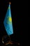 Flag Kazakhstan and magnifying glass on black background.Concept, under close attention