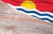 Flag Kiribati and space for text on a wooden background