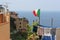 Flag upon laundry hung on to dry, Corniglia.