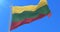 Flag of Lithuania waving at wind with blue sky in slow, loop