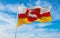 flag of Lublin Voivodeship, wojewodztwo lubelskie , Poland at cloudy sky background on sunset, panoramic view. Polish travel and