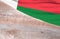 Flag Madagascar and space for text on a wooden background