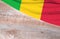 Flag Mali and space for text on a wooden background