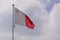 Flag malta National state maltese flag on wind mat with blue cloud sky