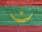 Flag of Mauritania on wooden wall background. Grunge Mauritania flag texture.