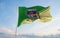 flag of Mesquita Rio de Janeiro , Brazil at cloudy sky background on sunset, panoramic view. Brazilian travel and patriot concept