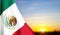 Flag of Mexico against the sunset