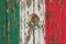 Flag of Mexico on a weathered wooden wall