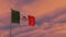 Flag of Mexico in the wind against the backdrop of a dramatic sunset sky