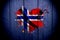 Flag of Norway in the shape of heart on a dark background