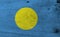Flag of Palau on wooden plate background. Grunge Palau flag texture.