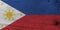 Flag of Philippines on wooden plate background. Grunge Philippines flag texture.