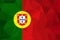 Flag of Portugal. Realistic waving flag of Portuguese Republic. Fabric textured flowing flag of Portugal.