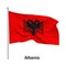 Flag of the Republic of Albania in the wind on flagpole