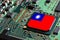 Flag of the Republic of China or Taiwan on semiconductor chip or microchip on a motherboard. Taiwan manufacturing chip industry