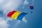 The flag of Romania carried in the sky by paratroopers