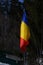 The flag of Romania hoisted at a Gura Diham chalet, Bucegi, Romania.