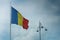 The flag of Romania waving. photo during the day.